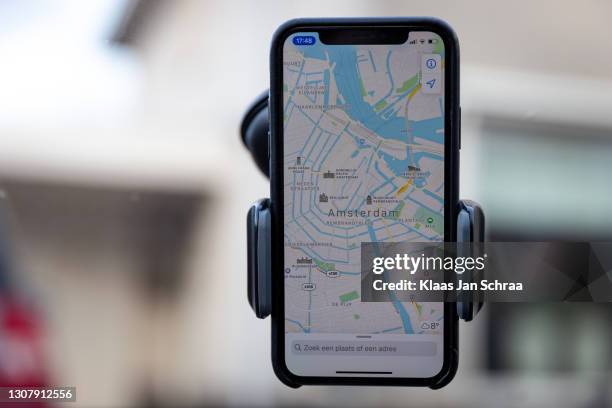 iphone navigation with maps in the car - amsterdam map stock pictures, royalty-free photos & images