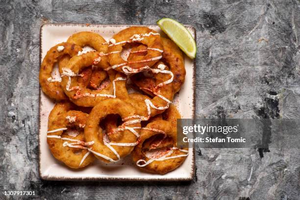 crispy fried onion rings with cheese snacks - onion ring stock pictures, royalty-free photos & images