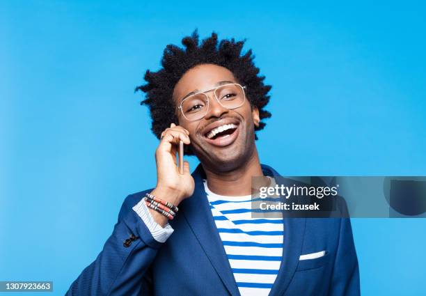 cheerful man talking on smart phone - phone coloured background stock pictures, royalty-free photos & images