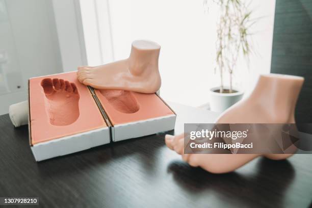 footprints with mannequin feet on the table - human spine stock pictures, royalty-free photos & images