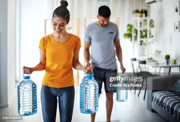 creative home workout. - gallon jug of water stock pictures, royalty-free photos & images