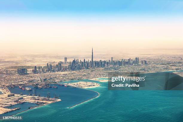 view of dubai skyscraper and burj khalifa,united arab emirates - airport aerial stock pictures, royalty-free photos & images