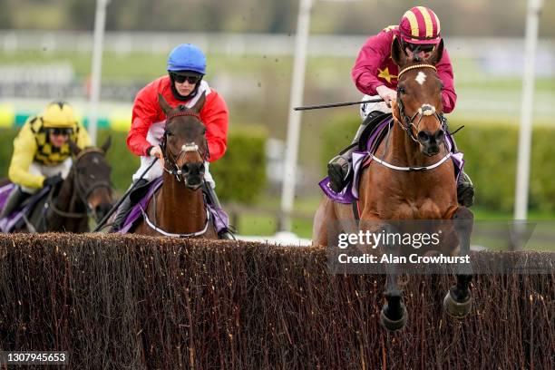 Jack Kennedy riding Minella Indo clear the last to win The WellChild Cheltenham Gold Cup Chase from Rachael Blackmore and A Plus Tard at Cheltenham...