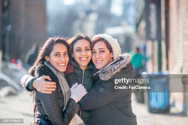 three beautiful sisters happy and smiling - afghani stock pictures, royalty-free photos & images