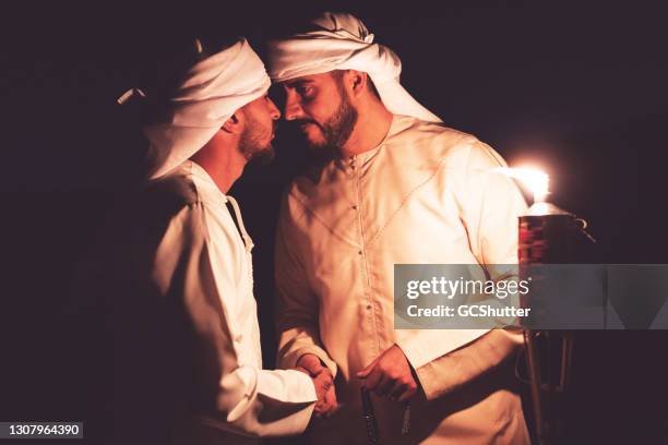 arab's traditional greeting - night safari stock pictures, royalty-free photos & images