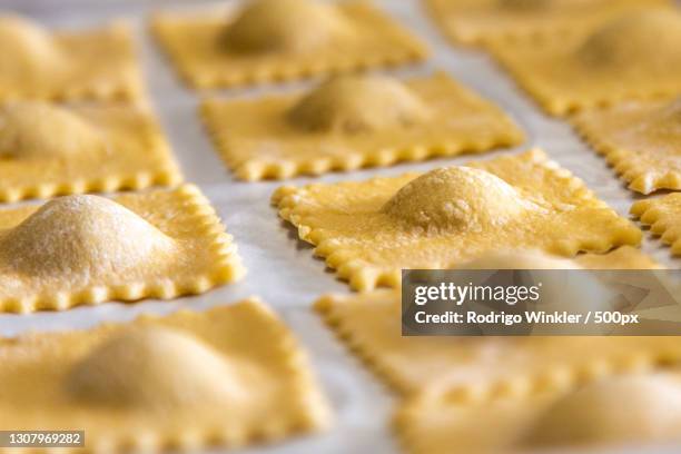 close-up of dough on baking sheet - ravioli stock-fotos und bilder