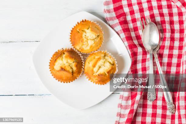 high angle view of dessert in plate on table - muffin top stock-fotos und bilder