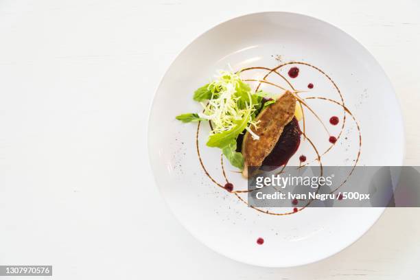 directly above shot of food in plate on white background - gourmet stock pictures, royalty-free photos & images