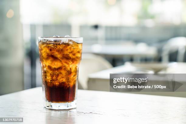 close-up of drink on table - cola stockfoto's en -beelden