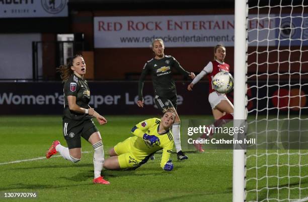 Jill Roord of Arsenal scores her sides first goal with a deflection off Millie Turner of Manchester United during the Barclays FA Women's Super...