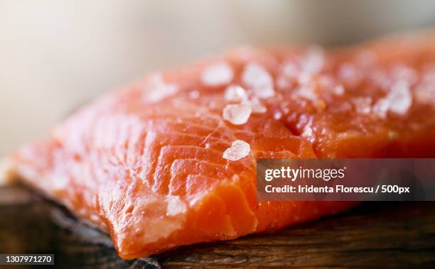 close-up of salmon on cutting board - trout stock pictures, royalty-free photos & images