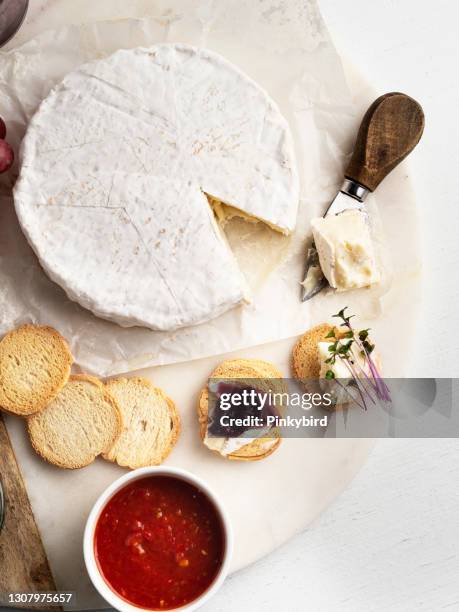 brie cheese, artisan cheeses, camembert cheese, white mould cheese, camembert cheese traditional french, - brie stock pictures, royalty-free photos & images