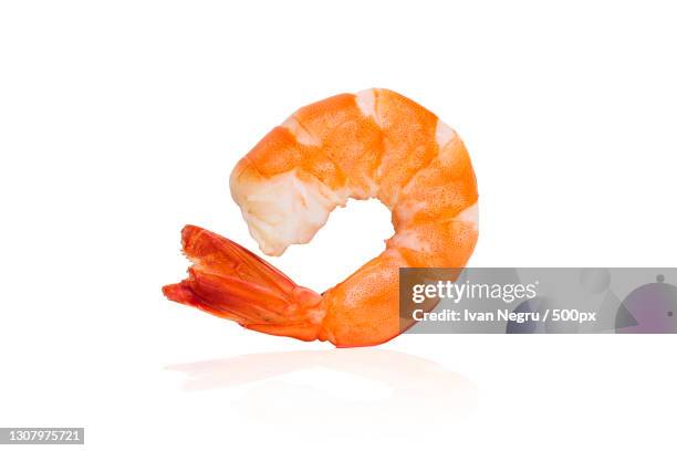 close-up of prawns against white background - prawn stock pictures, royalty-free photos & images