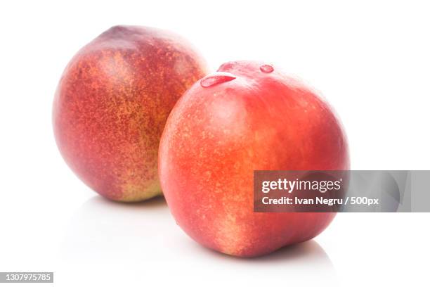 close-up of apples against white background - nectarine stock pictures, royalty-free photos & images