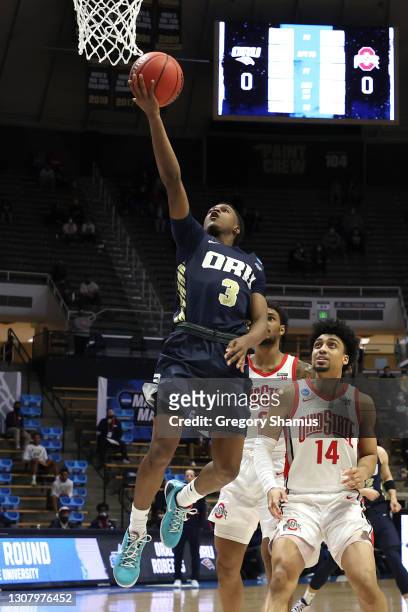 Max Abmas of the Oral Roberts Golden Eagles drives to the basket in the first half against the Ohio State Buckeyes in the first round game of the...