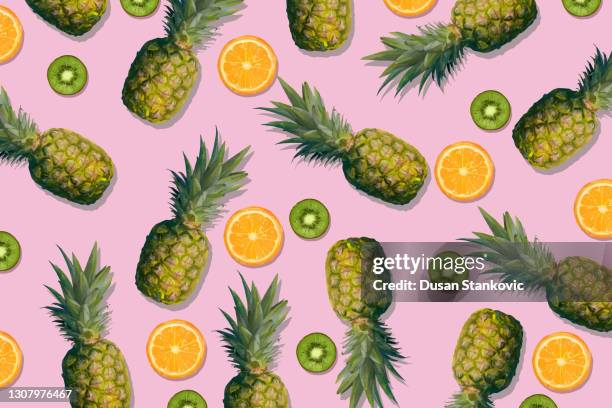 exotic wallpaper with pineapple, kiwi and orange - pineapple pattern stock illustrations