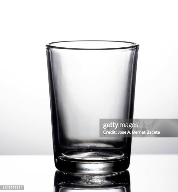 medium empty glass water glass on a white background. - empty glass stock pictures, royalty-free photos & images