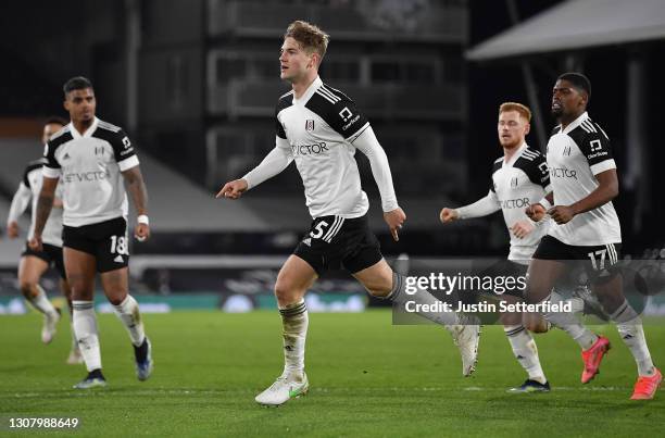 Joachim Andersen of Fulham celebrates with teammates after scoring their team's first goal during the Premier League match between Fulham and Leeds...
