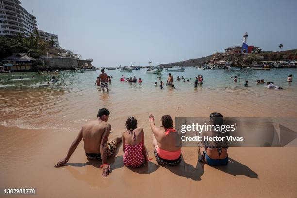 General view of the Caleta beach without any restrictions amid the coronavirus pandemic on March 19, 2021 in Acapulco, Mexico. Acapulco began its...