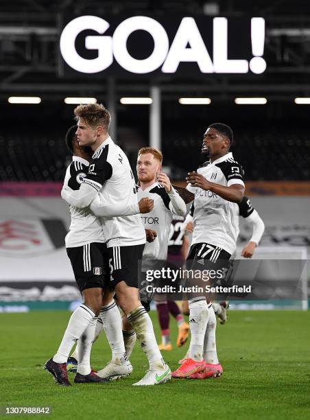 Joachim Andersen of Fulham celebrates with teammates Ademola Lookman, Harrison Reed and Ivan Cavaleiro of Fulham after scoring their team's first...