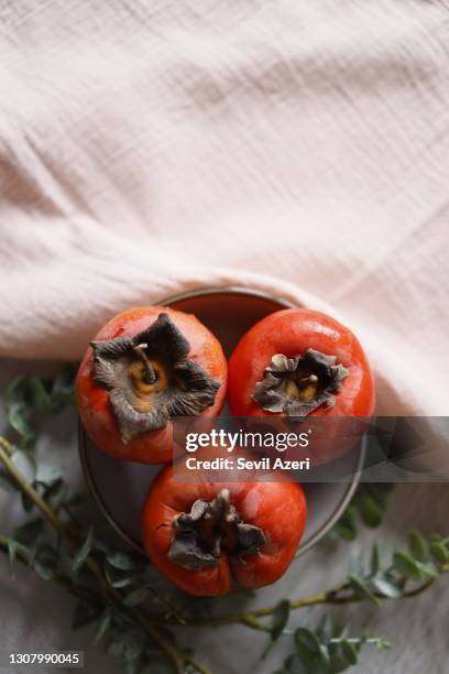758 Red Persimmon Stock Photos, High-Res Pictures, and Images