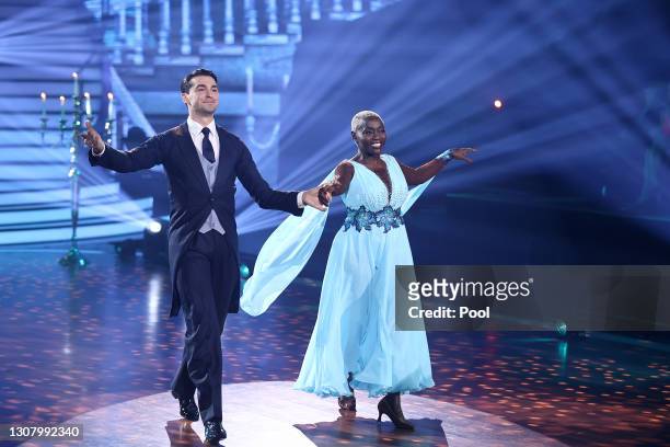 Auma Obama and Andrzej Cibis perform on stage during the 3rd show of the 14th season of the television competition "Let's Dance" on March 19, 2021 in...
