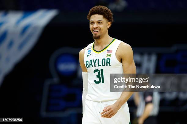 MaCio Teague of the Baylor Bears reacts after a play against the Hartford Hawks in the first round game of the 2021 NCAA Men's Basketball Tournament...