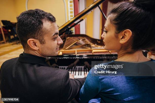 pianists duo - soloist stock pictures, royalty-free photos & images