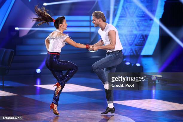 Rurik Gislason and Renata Lusin perform on stage during the 3rd show of the 14th season of the television competition "Let's Dance" on March 19, 2021...