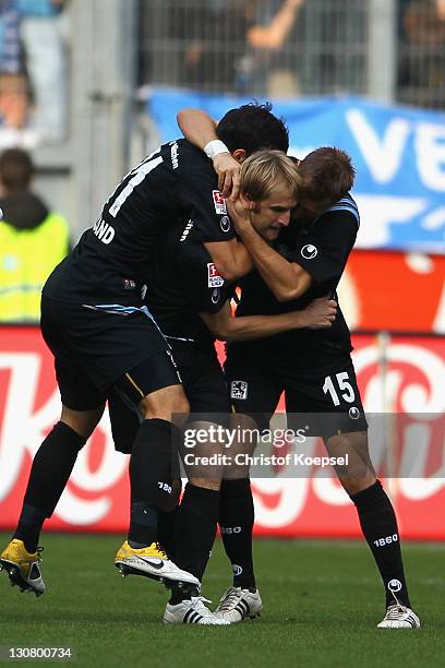 Daniel Bierofka celebrates the first go alwith Sandro Kaiser and Stefan Aigner of Muenchen during the Second Bundesliga match between MSV Duisburg...