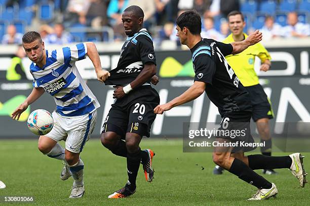 Collin Benjamin of Muenchen challenges Flamur Kastrati of Duisburg during the Second Bundesliga match between MSV Duisburg and TSV 1860 Muenchen at...