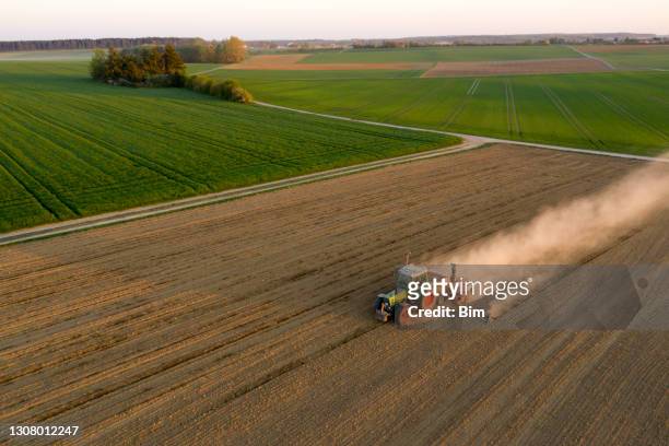 tractor sowing field, aerial view - sow stock pictures, royalty-free photos & images