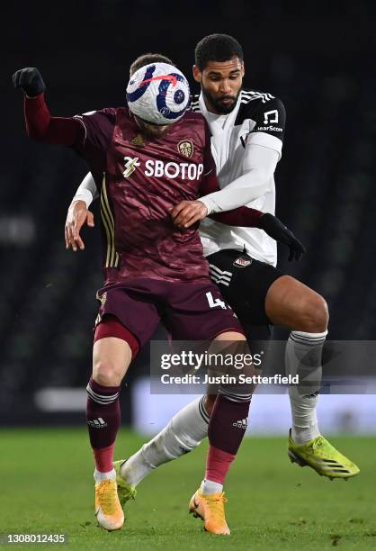 Mateusz Klich of Leeds United holds off Ruben Loftus-Cheek of Fulham during the Premier League match between Fulham and Leeds United at Craven...