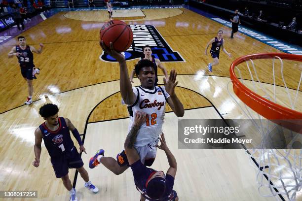 Matthew-Alexander Moncrieffe of the Oklahoma State Cowboys attempts to shoot the ball against the Liberty Flames during the second half in the first...