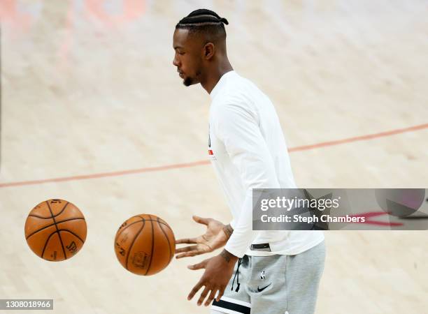 Harry Giles III of the Portland Trail Blazers warms up before the game against the Dallas Mavericks at Moda Center on March 19, 2021 in Portland,...