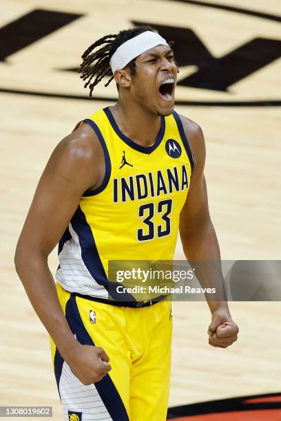 Myles Turner of the Indiana Pacers celebrates against the Miami Heat during the third quarter at American Airlines Arena on March 19, 2021 in Miami,...
