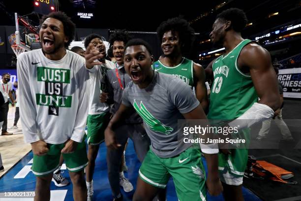 The North Texas Mean Green celebrate after beating the Purdue Boilermakers 78-69 in overtime in the first round game of the 2021 NCAA Men's...