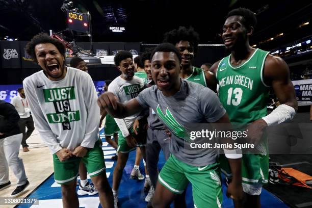 The North Texas Mean Green celebrate after beating the Purdue Boilermakers 78-69 in overtime in the first round game of the 2021 NCAA Men's...