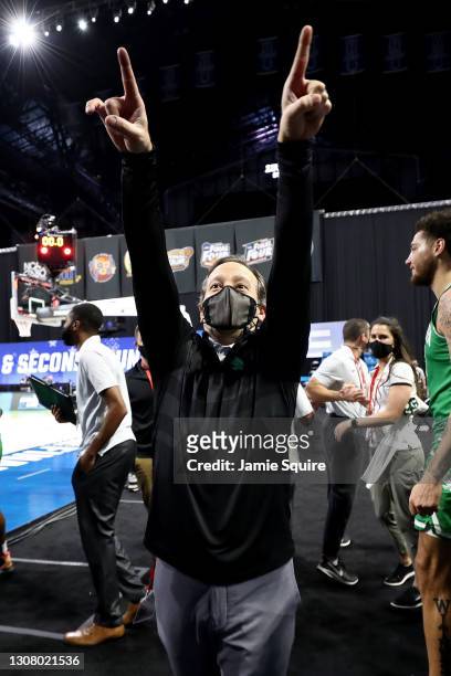 Head coach Grant McCasland of the North Texas Mean Green celebrates after beating the Purdue Boilermakers 78-69 in overtime in the first round game...