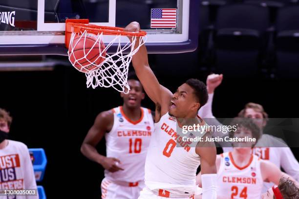 Clyde Trapp of the Clemson Tigers dunks the ball in the game against the Rutgers Scarlet Knights during the second half in the NCAA Basketball...