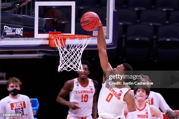 Clyde Trapp of the Clemson Tigers dunks the ball in the game against the Rutgers Scarlet Knights during the second half in the NCAA Basketball...