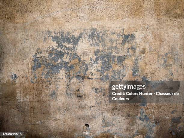 scratched painting on a concrete wall with natural patina in paris - rustic wall stock pictures, royalty-free photos & images