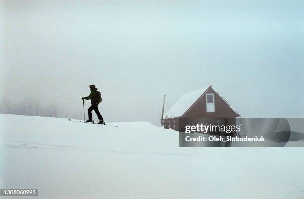 man on ski resort during the blizzard - winter sport walk old stock pictures, royalty-free photos & images