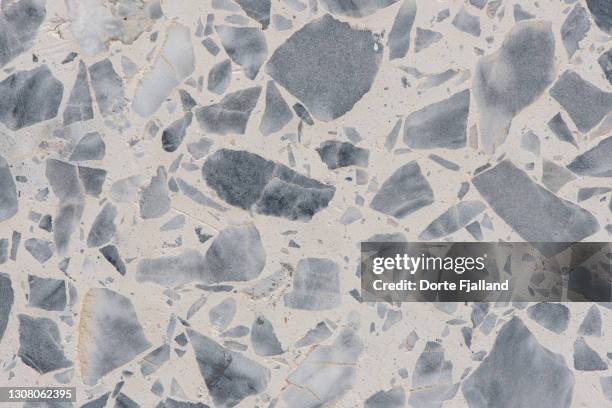 close up of light terrazzo with grey pieces - terrazzo ストックフォトと画像