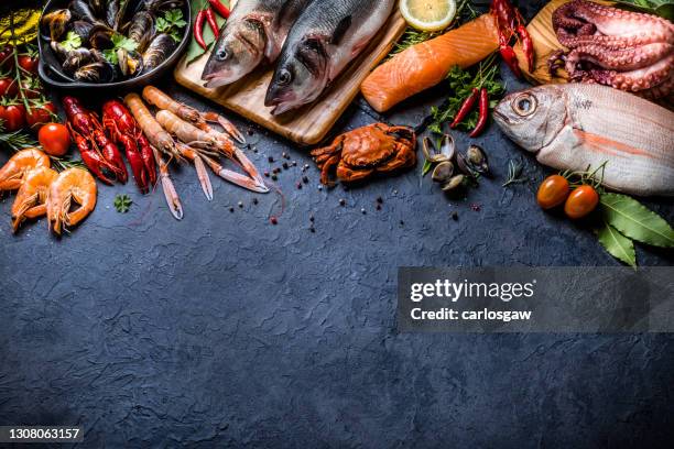 fresh fish and seafood background - catch of fish stock pictures, royalty-free photos & images