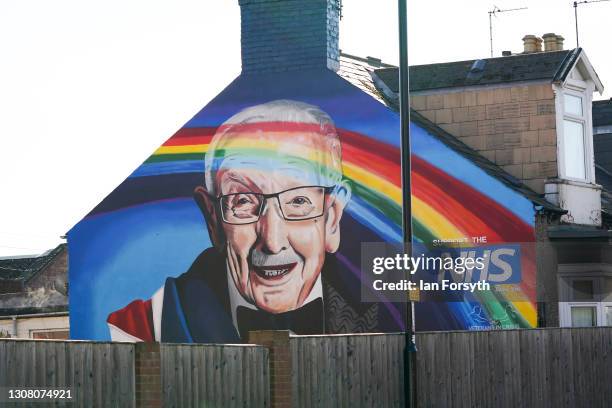 Wall mural depicting Captain Sir Tom Moore appears on a wall on March 20, 2021 in Sunderland, England. A mural remembering Captain Sir Tom Moore and...