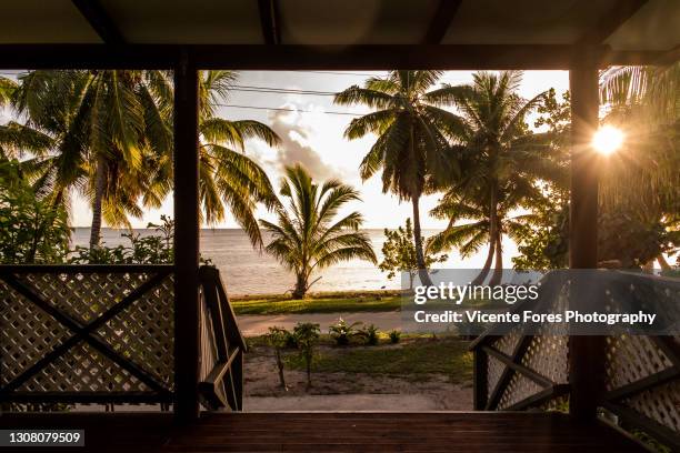 porch of an abandoned house with in aitutaki at sunset - アイツタキ ストックフォトと画像