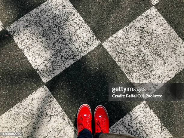 pov view of feet with red shoes - red shoe stock pictures, royalty-free photos & images