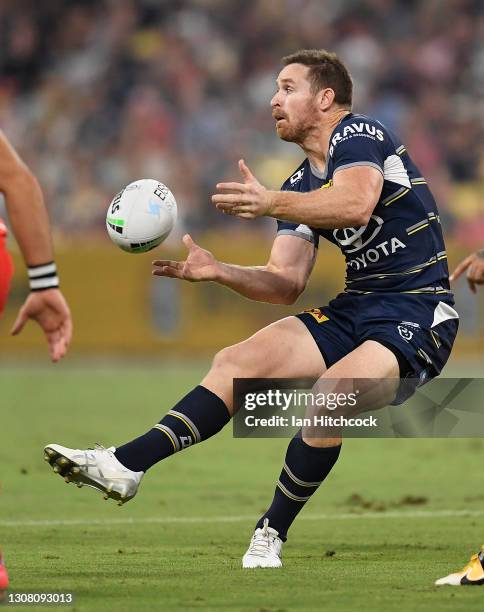 Michael Morgan of the Cowboys passes the ball during the round two NRL match between the North Queensland Cowboys and the St George Illawarra Dragons...