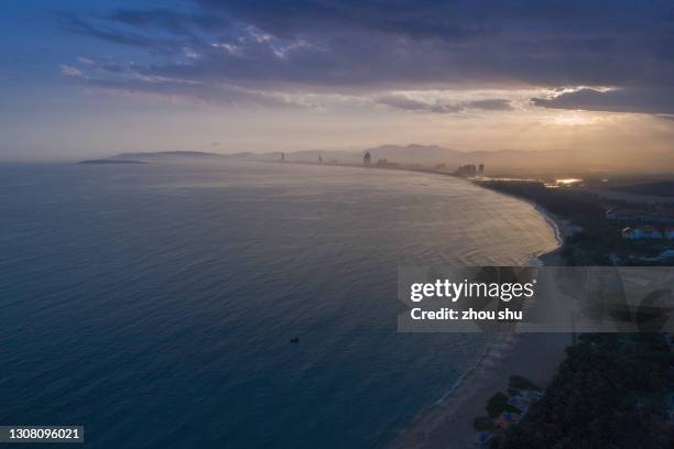 drone angle view of the haitang bay sunset located in sanya, china - novos territórios imagens e fotografias de stock